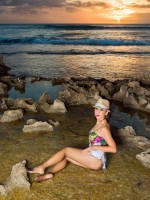 Stunning sunset on sea rocky shore with gorgeous mature lady Roni in wet pantyhose